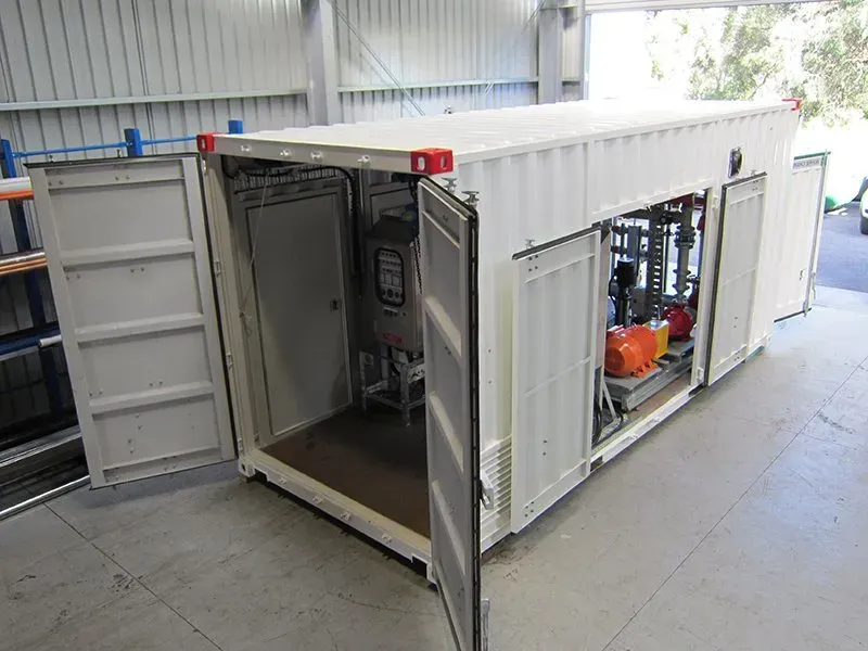 Containerised fire pump enclosure with doors open showing pumpset and control panel, Lithgow, NSW