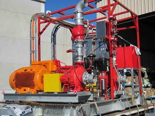 Electric fire pumpset with red pipework and control panel on a base frame for the Cobar fire pump enclosure, NSW